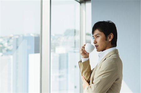 Businessman Drinking Coffee Stock Photo - Rights-Managed, Code: 859-03599191