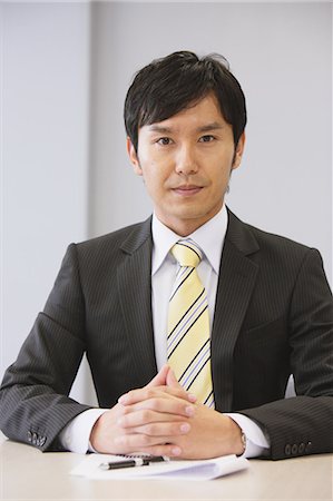 sitting at table white background - Businessman In A Meeting Stock Photo - Rights-Managed, Code: 859-03599329