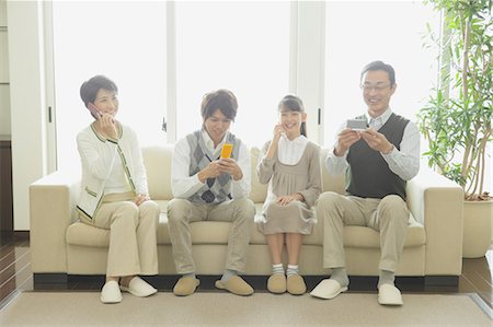 parents happy talk with teen - Family Talking On The Phone Stock Photo - Rights-Managed, Code: 859-03599409