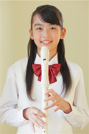recorder - A Girl Blowing Recorder Stock Photo - Rights-Managed, Code: 859-03599454