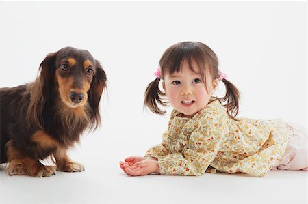 simsearch:859-03599527,k - Miniature Dachshund And A Girl Stock Photo - Rights-Managed, Code: 859-03599528