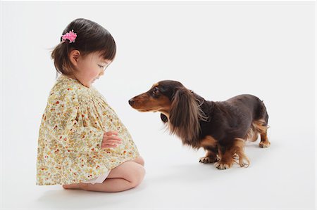 simsearch:859-03599527,k - Miniature Dachshund And A Girl Stock Photo - Rights-Managed, Code: 859-03599523