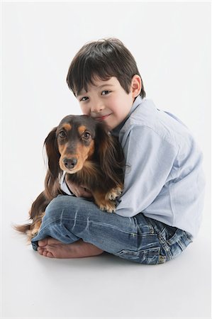 Miniature Dachshund And A Boy Stock Photo - Rights-Managed, Code: 859-03599543