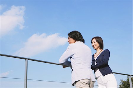 elegant 40 something couples - Couple Relaxing At Terrace Stock Photo - Rights-Managed, Code: 859-03599589