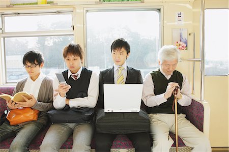 full body student holding laptop - Train Manners Stock Photo - Rights-Managed, Code: 859-03599594