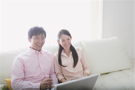 Japanese Couple Looking At PC Stock Photo - Rights-Managed, Code: 859-03599834