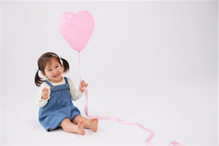 people sitting cutout white background - Japanese Girl Playing with Balloon Stock Photo - Rights-Managed, Code: 859-03600052