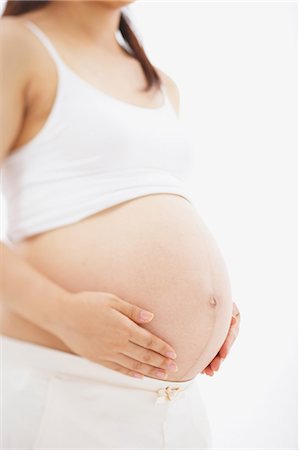 simsearch:859-03600091,k - Mittelteil der schwangeren Frau Stockbilder - Lizenzpflichtiges, Bildnummer: 859-03600088