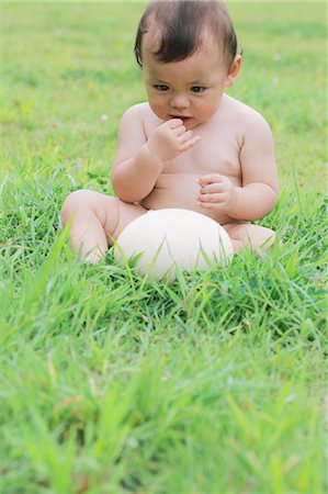 Baby Looking At An Egg Of Ostrich Stock Photo - Rights-Managed, Code: 859-03600146