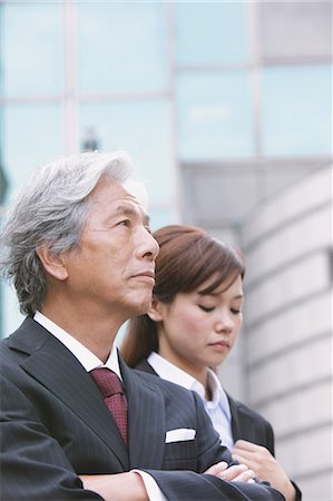 simsearch:859-03600374,k - Businessman And Businesswoman Looking Up Stock Photo - Rights-Managed, Code: 859-03600365