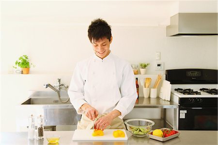 person cutting food on cutting boards - Chef Cooking Foto de stock - Con derechos protegidos, Código: 859-03600596