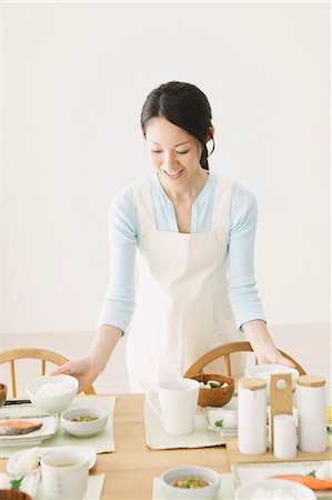 dining room with green chairs - Japanese Woman Preparing Stock Photo - Rights-Managed, Code: 859-03600678