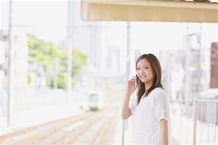 Japanese Teenage Girl Waiting On Platform Stock Photo - Rights-Managed, Code: 859-03730590