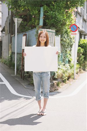 sandal girl - Japanese Woman Holding A Whiteboard Stock Photo - Rights-Managed, Code: 859-03730619