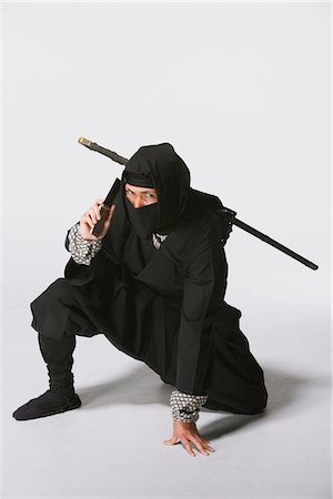 Ninja Using Mobile Stock Photo - Rights-Managed, Code: 859-03730743