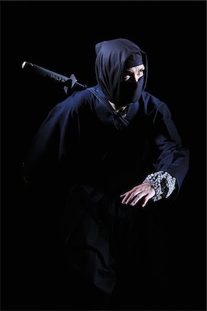 stealth fighter - Ninja With Black Background Foto de stock - Con derechos protegidos, Código: 859-03730808