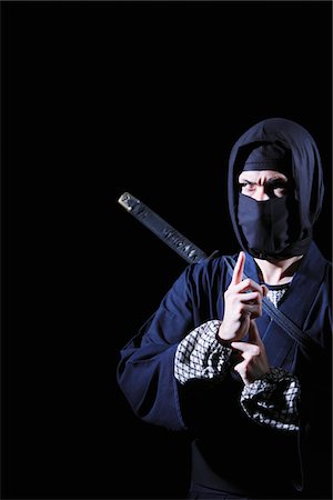 stealth fighter - Ninja With Black Background Foto de stock - Con derechos protegidos, Código: 859-03730803