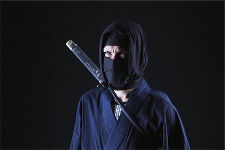 stealth fighter - Ninja With Black Background Foto de stock - Con derechos protegidos, Código: 859-03730814