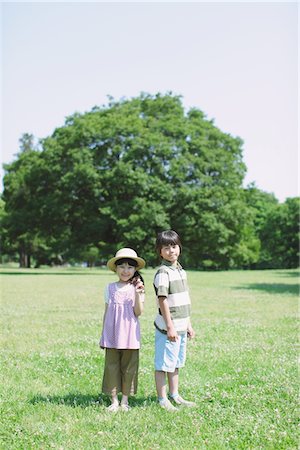 Two Children Standing In a Park Stock Photo - Rights-Managed, Code: 859-03755308