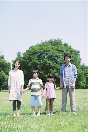 father mother kid holding hands in park - Portrait Of A Japanese Family Stock Photo - Rights-Managed, Code: 859-03755317