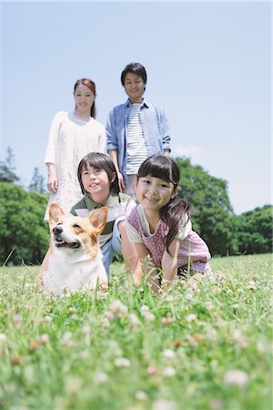 family dog lifestyle - Cute Girl Enjoying With Her Family Stock Photo - Rights-Managed, Code: 859-03755340