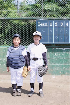 Portrait Of Boys In Baseball Uniform Foto de stock - Con derechos protegidos, Código: 859-03755409