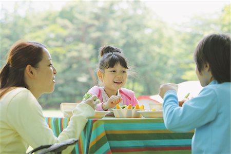 Japanese Woman Enjoying Food With Children Stock Photo - Rights-Managed, Code: 859-03755402