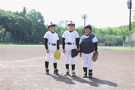 Baseball Player Standing At Playground Stock Photo - Rights-Managed, Code: 859-03755415