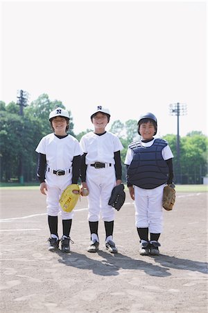 Joueur de baseball qui posent au terrain de jeux Photographie de stock - Rights-Managed, Code: 859-03755417