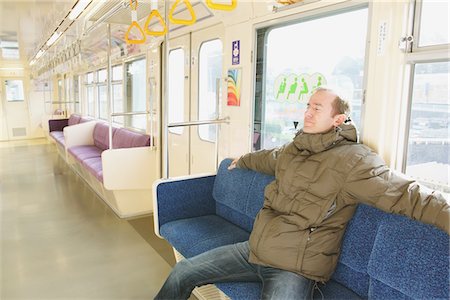 Adult man seated in a train Stock Photo - Rights-Managed, Code: 859-03755479