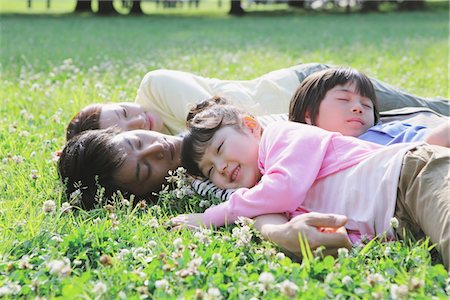 Family Relaxing At Grassland Stock Photo - Rights-Managed, Code: 859-03755470