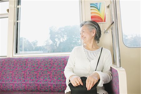 Haute femme voyageant dans un train Photographie de stock - Rights-Managed, Code: 859-03755497