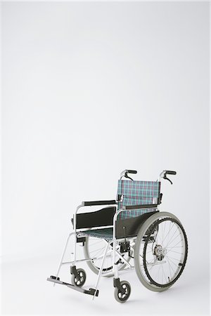 silla de ruedas - Side View Of A Wheelchair Foto de stock - Con derechos protegidos, Código: 859-03755584