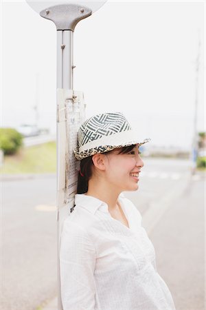 sidewalk blur - Young Trendy Woman Wearing Hat Stock Photo - Rights-Managed, Code: 859-03779909