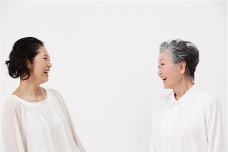 picture of elderly cheering - Mother And Adult Daughter Laughing Face To Face Stock Photo - Rights-Managed, Code: 859-03779992