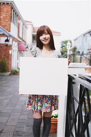 people holding a poster - Young Girl Holding Whiteboard Stock Photo - Rights-Managed, Code: 859-03780088