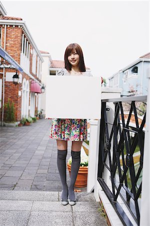 Teenage Girl Holding Whiteboard Stock Photo - Rights-Managed, Code: 859-03780089