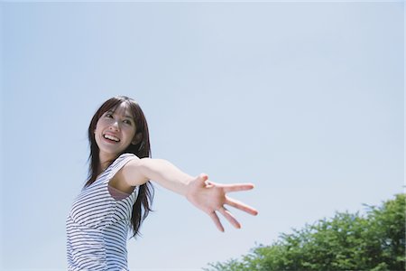 simsearch:859-03840420,k - Young Woman Arm Stretched Stock Photo - Rights-Managed, Code: 859-03780136