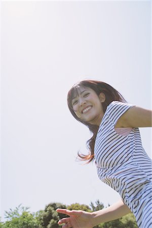 run in park asian - Young Woman Smiling Stock Photo - Rights-Managed, Code: 859-03780141