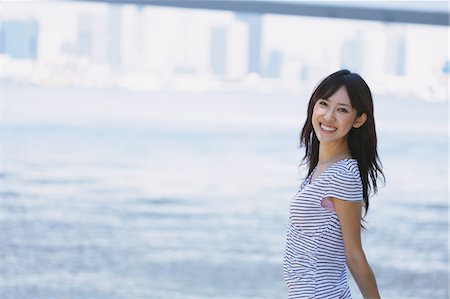 simsearch:622-06190754,k - Young Woman Enjoying Near River Stock Photo - Rights-Managed, Code: 859-03780175