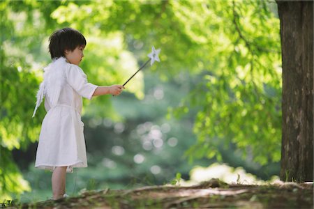 fantasy (not sexual) - Angel Boy Standing Holding Magic Wand Stock Photo - Rights-Managed, Code: 859-03781906