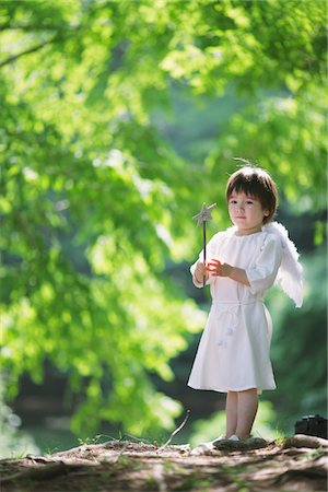 fat kids not adults - Boy Holding Magic Wand Stock Photo - Rights-Managed, Code: 859-03781907