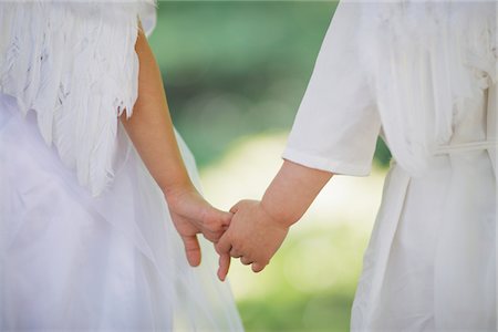 rear view of two children holding hands - Angels Standing Holding Hands Stock Photo - Rights-Managed, Code: 859-03781914