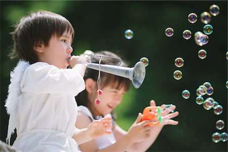 Children Playing Trumpet and Blowing Bubbles Stock Photo - Rights-Managed, Code: 859-03781947
