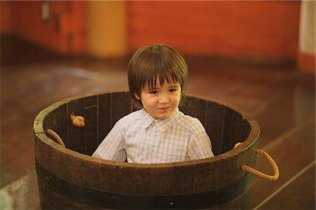 Boy Hiding in Barrel Stock Photo - Rights-Managed, Code: 859-03781978