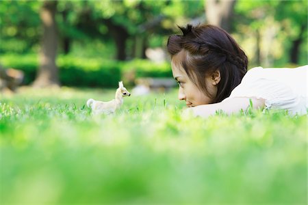 Japanese Young Woman Lying on Grass Stock Photo - Rights-Managed, Code: 859-03782245