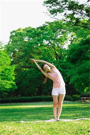 exercise and stretching for girls - Young Woman Practising Yoga in Park Stock Photo - Rights-Managed, Code: 859-03782250