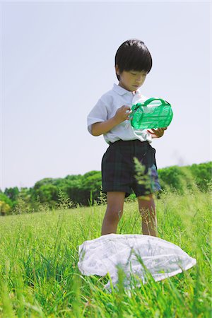 simsearch:859-03782433,k - Boy Standing in Park Holding Box Stock Photo - Rights-Managed, Code: 859-03782303