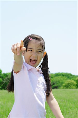 pointing finger - Girl Enjoying in Park Stock Photo - Rights-Managed, Code: 859-03782336