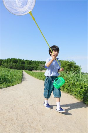 simsearch:859-03782433,k - Boy Walking on Pathway in Park Stock Photo - Rights-Managed, Code: 859-03782434